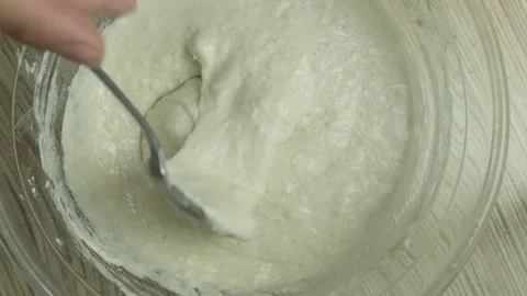 Kneading the dough. The process of making a delicious treat or dessert. Ingredie Stock Footage 163594266