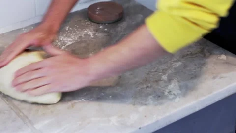 Kneading a dough roll for some pastries Stock Footage 155457904