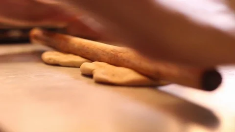 Kneading dough with rolling pin to make sweet bread Stock-Footage 130083477