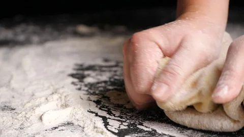 Kneading dough in slow motion Stock Footage 117860220