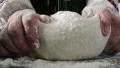 Kneading dough on table HD Footage