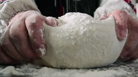 Kneading dough on table Stock Footage 9484242