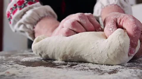 Kneading dough on table Stock Footage 9484250