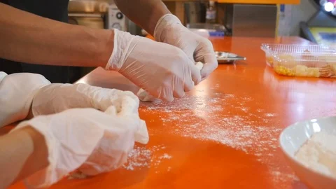 Kneading the dough on the table Stock Footage 111566718