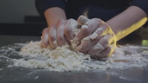 Kneading dough on the table Stock Footage 138581960