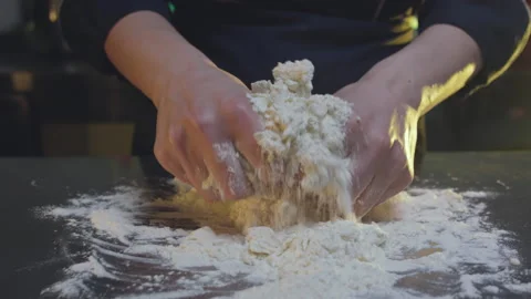 Kneading dough on the table Stock Footage 138582310