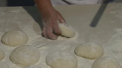 Kneading the dough on the table full of flour . Close up footage 動画素材 90718474