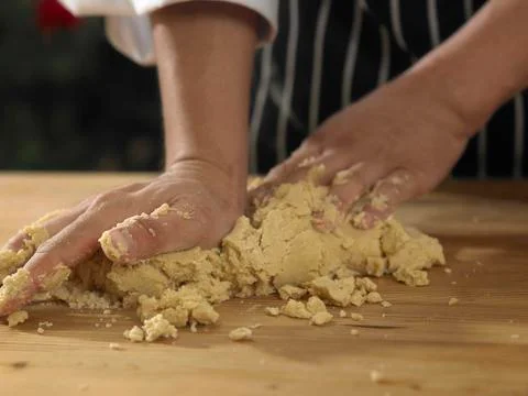 Kneading dough on table Stock-Fotos