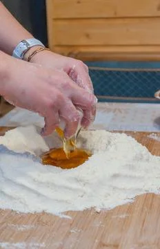 Kneading flour and eggs Stock Photos