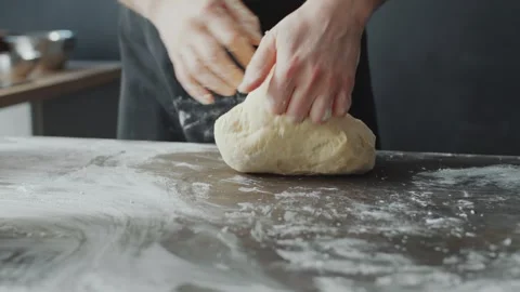 Kneading Fresh Dough for Making Burger Buns on a Floured Kitchen Table Vidéo 331100874