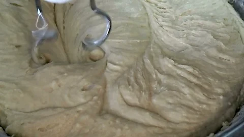 Kneading pastry dough with a mixer. Stock Footage
