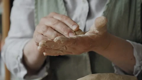 Kneading a piece of clay Video stock 218604589