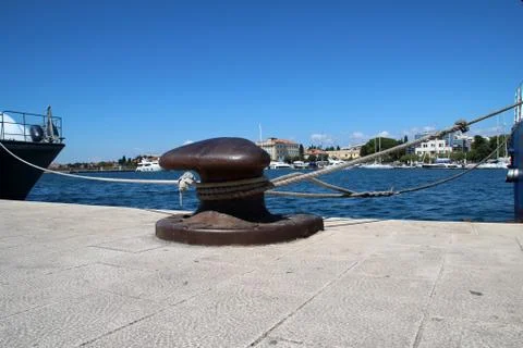 Knecht on the dock for fixing cables Stock Photos