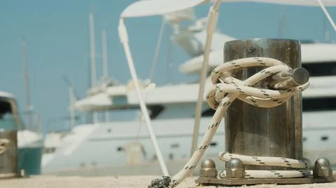 Knecht on the pier with rope in close-up Stock Photos