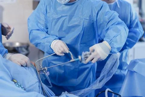 Knee Arthroscopy Procedure with Surgical Instruments in Operating Room Stock Photos