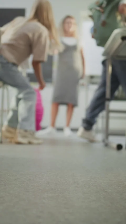 Knee Level Shot of Elementary School Children Entering Modern Classroom Stock Footage 315536739