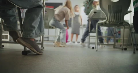 Knee Level Shot of Elementary School Children Entering Modern Classroom Stock Footage 315537232