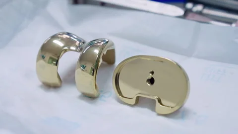 Knee replacement implants on the white napkin. Close up.  Stock Footage 264785345