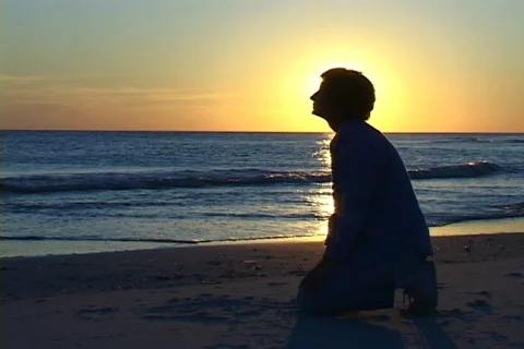 Kneeling At The Beach Stock Footage 613623