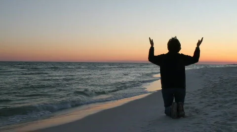 Kneeling In Prayer At Sunset Video stock 662857
