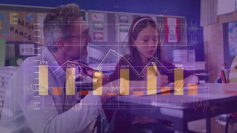 Kneeling teacher pointing to math workbook causing charts sliding as student Stock Footage 310973466