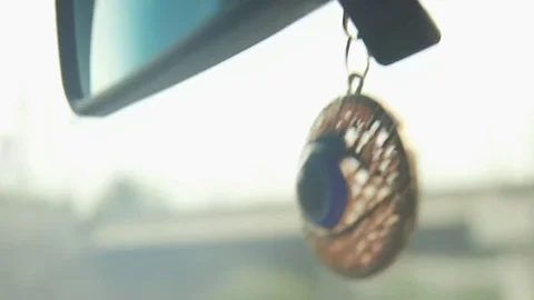 Knick-knack hanging from car Видео 77047563
