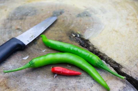 Knife and chilli Stock Photos