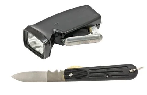 Knife and flashlight Stock Photos