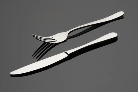 Knife and fork on a gray background. Cutlery. 스톡 사진