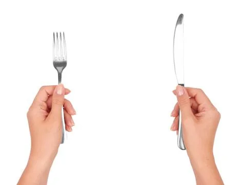 A knife and fork in hands Stock Photos