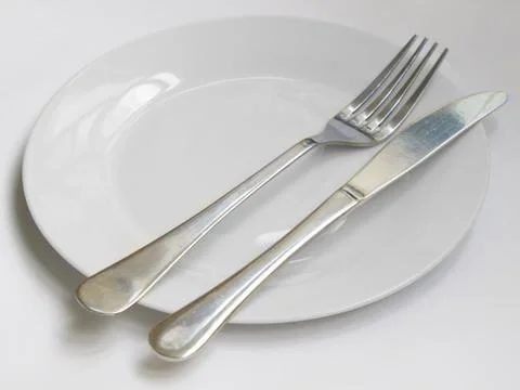 Knife and fork plate Stock Photos