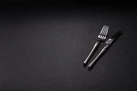 A knife and fork, silver kitchen utensils for the dining table. A knife and.. Stock Photos