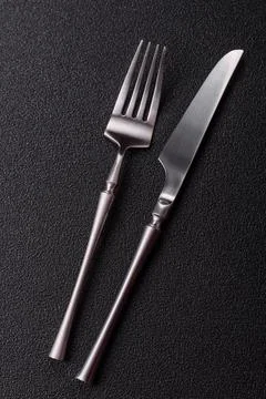 A knife and fork, silver kitchen utensils for the dining table. A knife and.. Stock Photos
