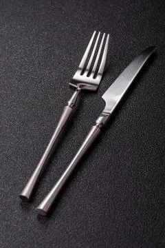 A knife and fork, silver kitchen utensils for the dining table. A knife and.. Stock Photos