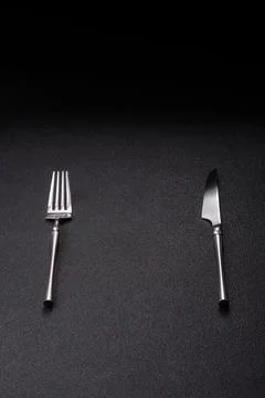 A knife and fork, silver kitchen utensils for the dining table. A knife and.. Stock Photos