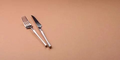 A knife and fork, silver kitchen utensils for the dining table. A knife and.. Stock Photos