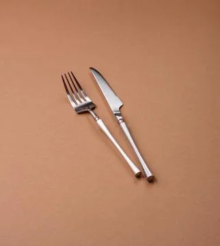 A knife and fork, silver kitchen utensils for the dining table. A knife and.. Stock Photos
