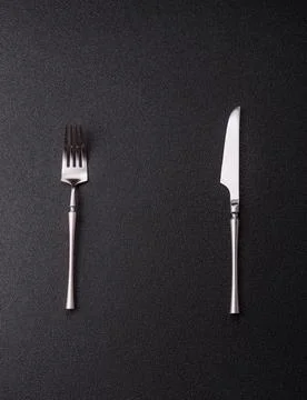A knife and fork, silver kitchen utensils for the dining table. A knife and.. Stock Photos