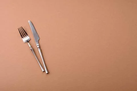 A knife and fork, silver kitchen utensils for the dining table. A knife and.. Stock Photos