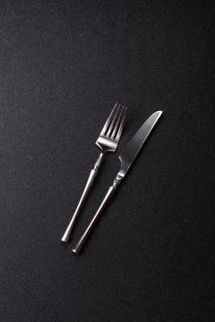 A knife and fork, silver kitchen utensils for the dining table. A knife and.. Stock Photos