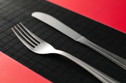 Knife and fork on the tablee Stock Photos