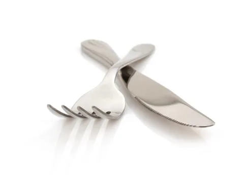 Knife and fork on white background Stock Photos