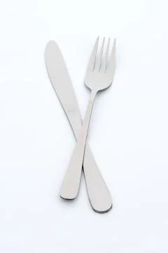 Knife and fork on white background Stock Photos