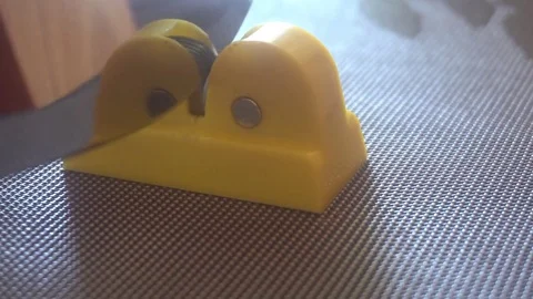 Knife and sharpener for a knife in the hands of man. Manual sharpening of a Stock Footage 75912274