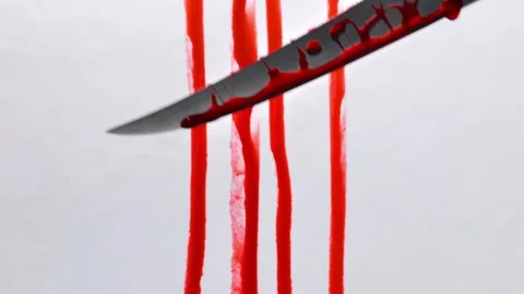 Knife attack.Drops of blood dripping from a knife Stock Footage 306876811