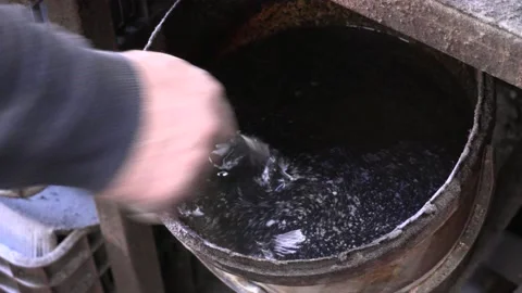 Knife blacksmith working in his knife workshop. Stock Footage 195728381