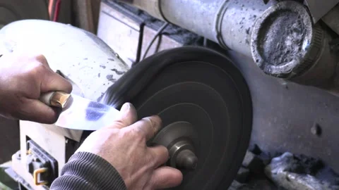Knife blacksmith working in his knife workshop. Stock Footage 195740709