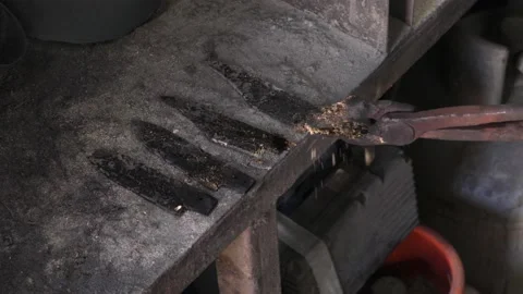 Knife blacksmith working in his knife workshop. Stock Footage 195811975