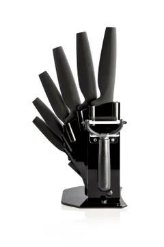 Knife block with 6 different black knives and peeler Stock Photos
