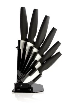 Knife block with 6 different black knives and peeler Stock Photos